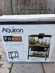 Aqueon Forge Aquarium Stands 30 X 12 Reversible Wood Panels. Fixed Price $130.00.